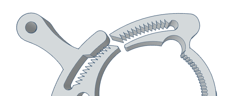 Close-up view of a firearm accessory component with interlocking teeth and a hook.