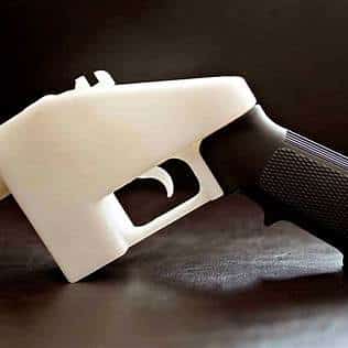A 3D printed firearm frame with a black grip and a white body.