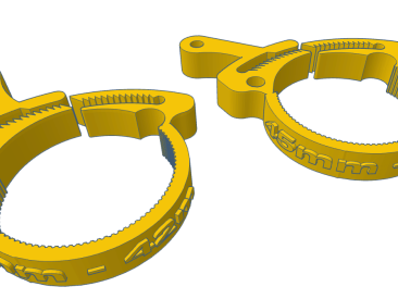 Two yellow firearm accessory clamps designed for securing components with a 45mm diameter.