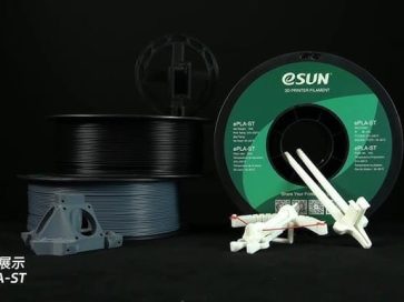 3D Printing Filament and Accessories Spools of ePLA-ST 3D printing filament with printed parts displayed in front.